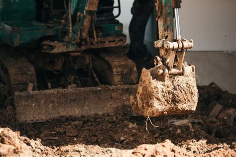 can you dig a foundation with a mini excavator|how to dig footings with a mini.